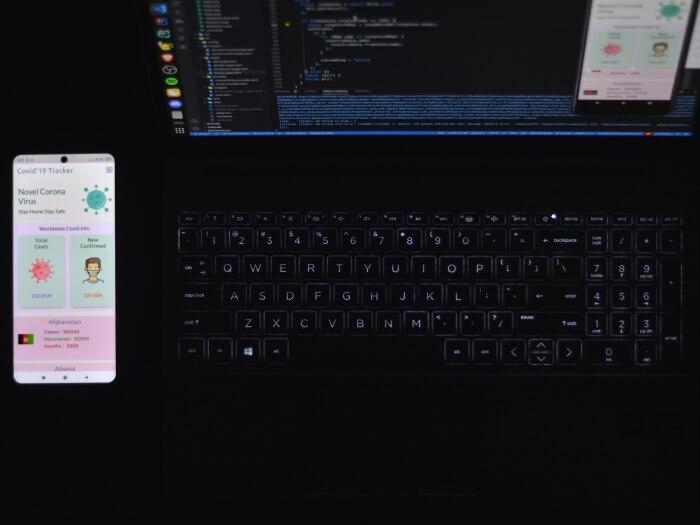 A laptop and a phone showing a flutter app design
